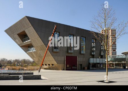 Public Library unusual shape at Canada Water with entrances to below ground train stations in Rotherhithe district of South East London England UK Stock Photo