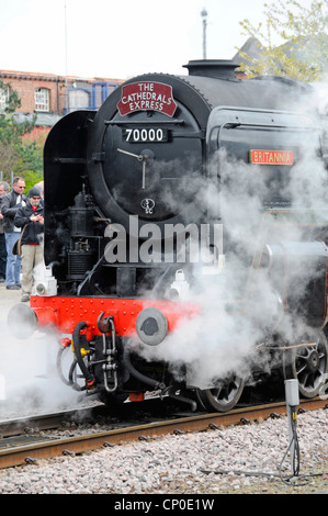 Front of restored Britannia 70000 steam locomotive built in 1951 on charter run for enthusiasts arriving Chester railway station Cheshire England UK Stock Photo