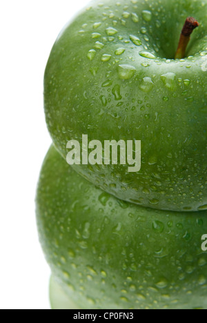 Close up from above of tower made of two green apples isolated on white Stock Photo