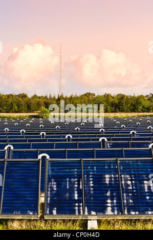 Solar heating plant producing hot water for power and house heating Stock Photo