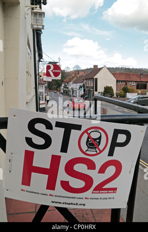 A 'Stop HS2' poster on a railing in the shopping high street of Wendover, Buckinghamshire, UK. (Apr 2012) Stock Photo