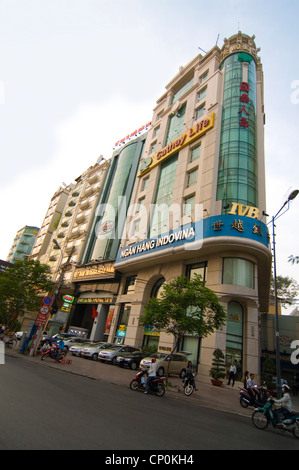 Horizontal view of a typical row of tall, thin tubular office blocks in Ho Chi Minh City, Vietnam. Stock Photo