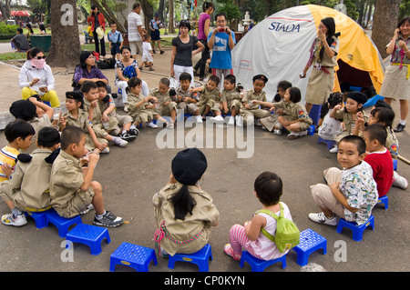 Horizontal wide angle of a Vietnamese Scout Group jamboree held in Tao Dan Cultural Park in Ho Chi Minh City, Vietnam. Stock Photo