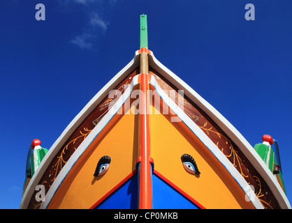 Richly decorated bow of traditional wooden fishing boat, St Paul's Bay, Malta, Southern Europe. Stock Photo
