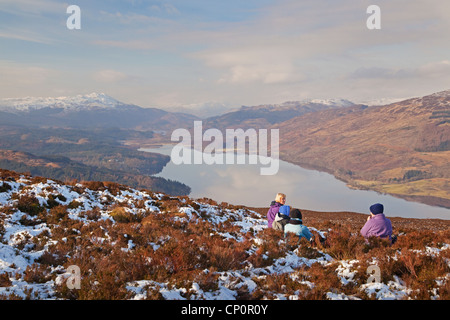 Walkers on Ben Gullipen, looking down Loch Venachar near Callander Stock Photo