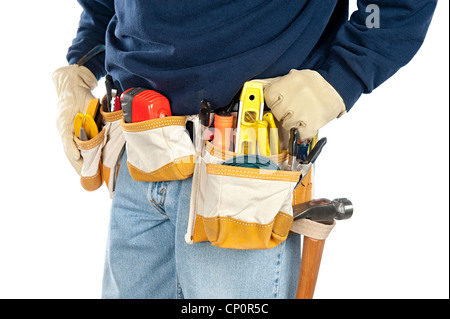 A skilled tradesman stands with his fully loaded tool belt ready to work. Isolated on white for designer convenience. Stock Photo