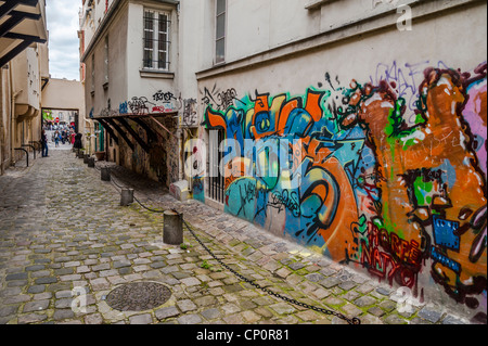 Graffiti covered wall in the Marais section of Paris, France. Stock Photo