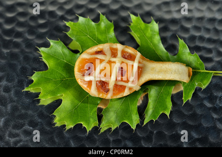 Image of a peach tart with bacon on an oak leaf Stock Photo