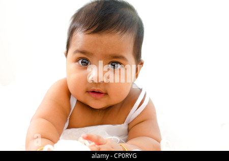 Adorable 6 months old Indian baby girl looking at camera Stock Photo