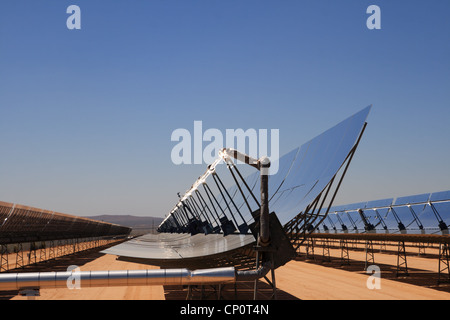 SEGS solar thermal energy desert electricity plant with parabolic mirrors concentrating the sunlight with blue sky copy space Stock Photo