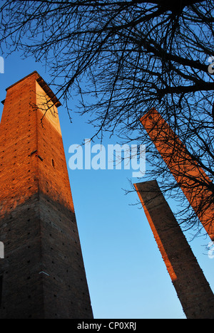 Medieval towers on blue sky at sunset, Leonardo Da Vinci square, Pavia, Lombardy, Italy Stock Photo