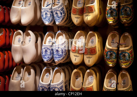 Wooden shoes Dutch souvenirs hanging on wall in shop Stock Photo