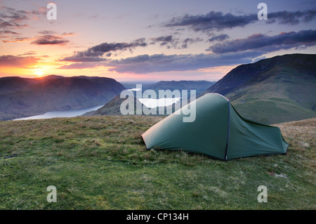 Wild Camping at sunset on High Snockrigg, Robinson, above Buttermere and Crummock Water in the English Lake District Stock Photo