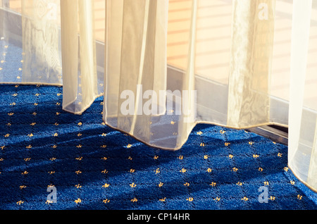 Yellow tennis ball on bench by tennis court Stock Photo