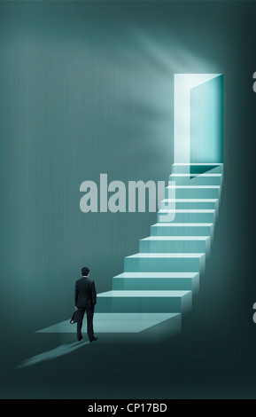A businessman standing in front of the stairs Stock Photo