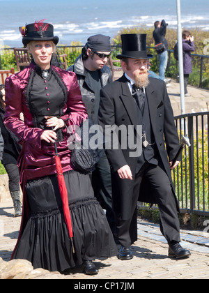 A man and his woman partner in Victorian Gothic dress at the Whitby Goth Week End spring 2012 Stock Photo