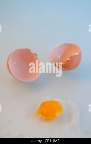 Cracked egg with a small yolk. Stock Photo