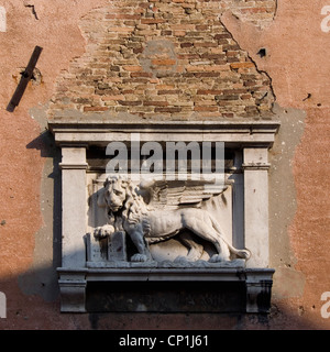 Lion sculpture on Venice building exterior. Stock Photo