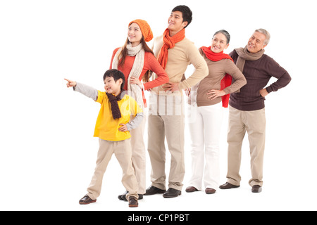 Family members looking afar and pointing the front Stock Photo