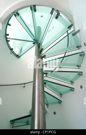 Moonraker. The steel and glass spiral staircase. Looking up through the glass treads. Stock Photo