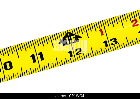 Yellow metal tape measure at about the one foot mark isolated on a pure white background. Stock Photo