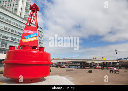 Ireland, North, Belfast, Donegall Quay, New office development on the banks of the river Lagan with red buoy in the foreground. Stock Photo