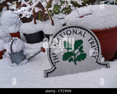 Garden with National Trust 'Omega' sign featured and fresh winter snow Surrey  England UK Stock Photo