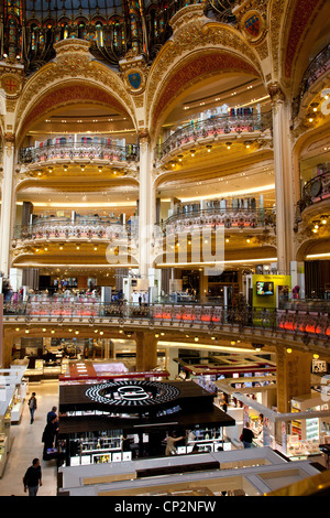 The steel and glass dome is a highlight of shopping in Galeries Lafayette in Paris Stock Photo