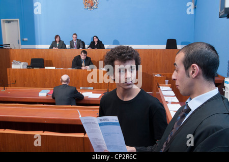 A defendant being advised how to pay a fine after being found guilty in a Magistrates Court Stock Photo