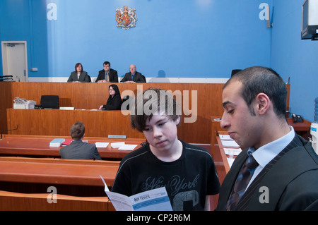 A defendant being advised how to pay a fine after being found guilty in a Magistrates Court Stock Photo