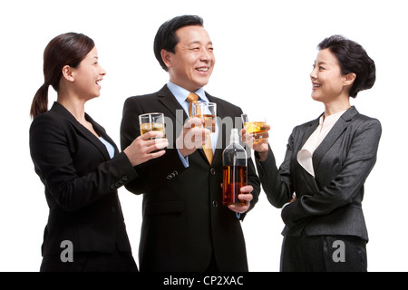 Business team enjoying whiskey Stock Photo