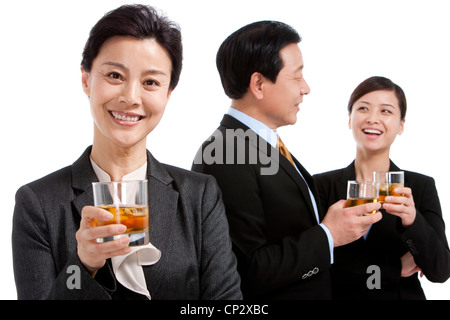 Business team enjoying whiskey Stock Photo