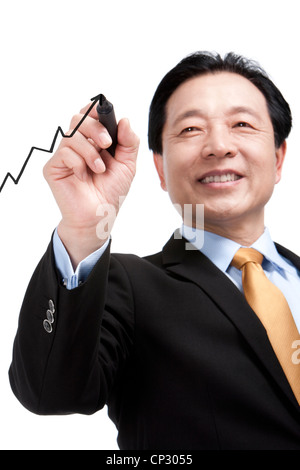 Senior businessman drawing a diagram Stock Photo