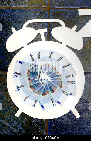 white cutout of an alarm clock with euro notes in the middle. 'times up for the euro currency'