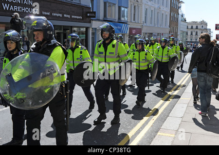Riot police running along a street in Brighton UK Stock Photo - Alamy