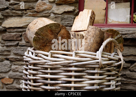 Firewood in basket in front of old house, Cardrona, Otago, South island, New Zealand Stock Photo