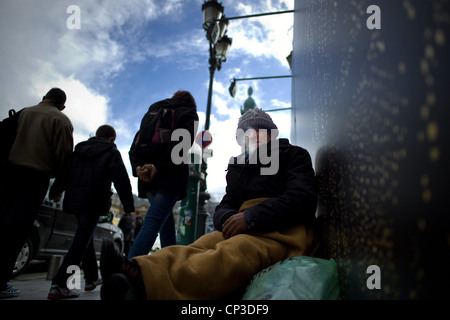 Urban poverty, A Romanian, in place of Vendome in Paris Stock Photo