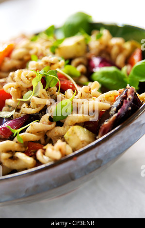 Whole wheat spirali pasta with stir fried Ratatouille vegetables. Stock Photo