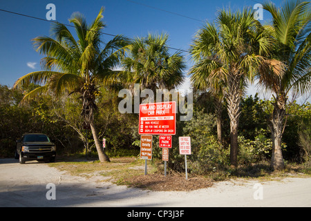 Parking rules, signs on Sanibel Island Florida beaches - Pay and Display Car Park - strictly enforced - pay to park Stock Photo