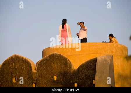 Indian tourists photograph each other on the Ramparts around the Nahargarh Fort, Jaipur, India Stock Photo