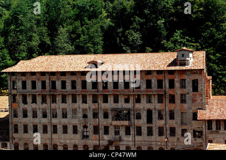 Piedmont Biella. One of buildings of former mill Maurizio Sella, industrial archaeological complex (XVII-XIX century) on banks Stock Photo