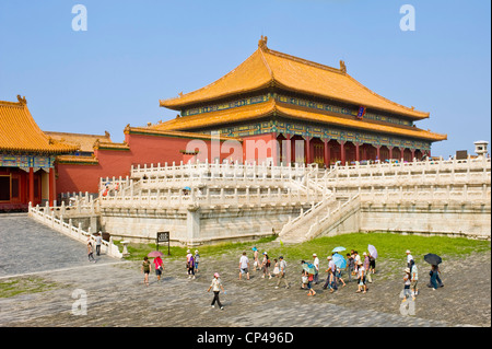 Tourists inside the Forbidden City with The Hall of Supreme Harmony in the background. Stock Photo