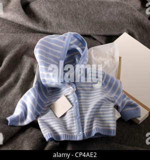 A still life shot of cute baby clothes Stock Photo