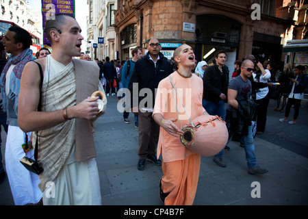 Hare Krishna group singing in central London on Oxford Street. UK. Stock Photo