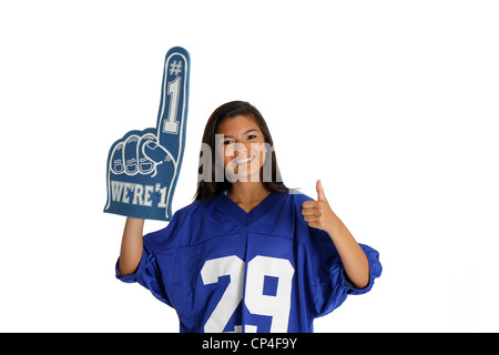 Teenage girl set against a white background in jersey Stock Photo