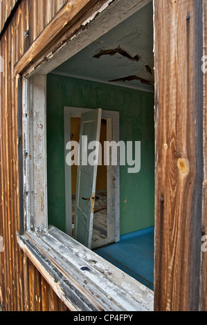 Greenland - West Coast - Qunlissat. Abandoned mining town. Detail: broken doors. Stock Photo