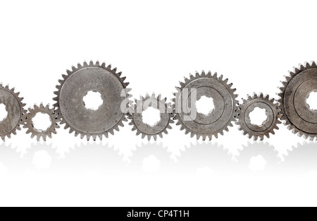 Old metallic cog gears arranged in a row. Stock Photo