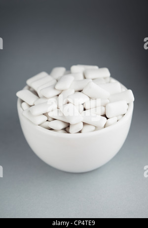 White chewing gum in a white bowl Stock Photo