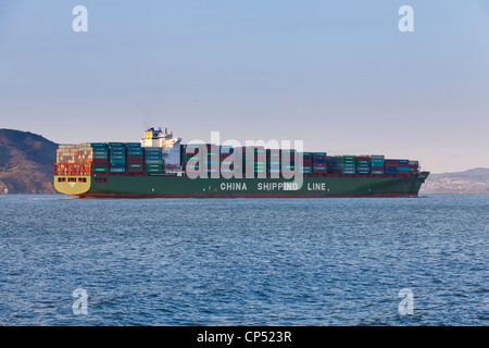 A China Shipping Line freighter ship full of cargo entering US port - San Francisco, California USA Stock Photo