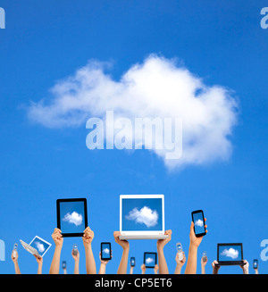 cloud computing concept.hands holding computer laptop smart phone tablet and touch pad Stock Photo